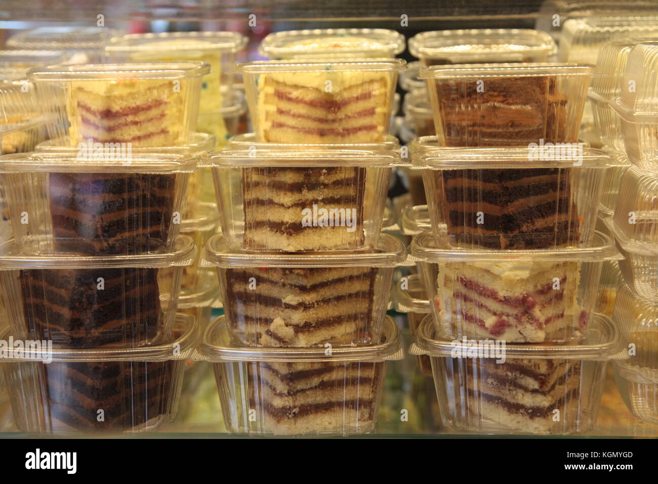 Cake slices in plastic boxes Stock Photo Alamy