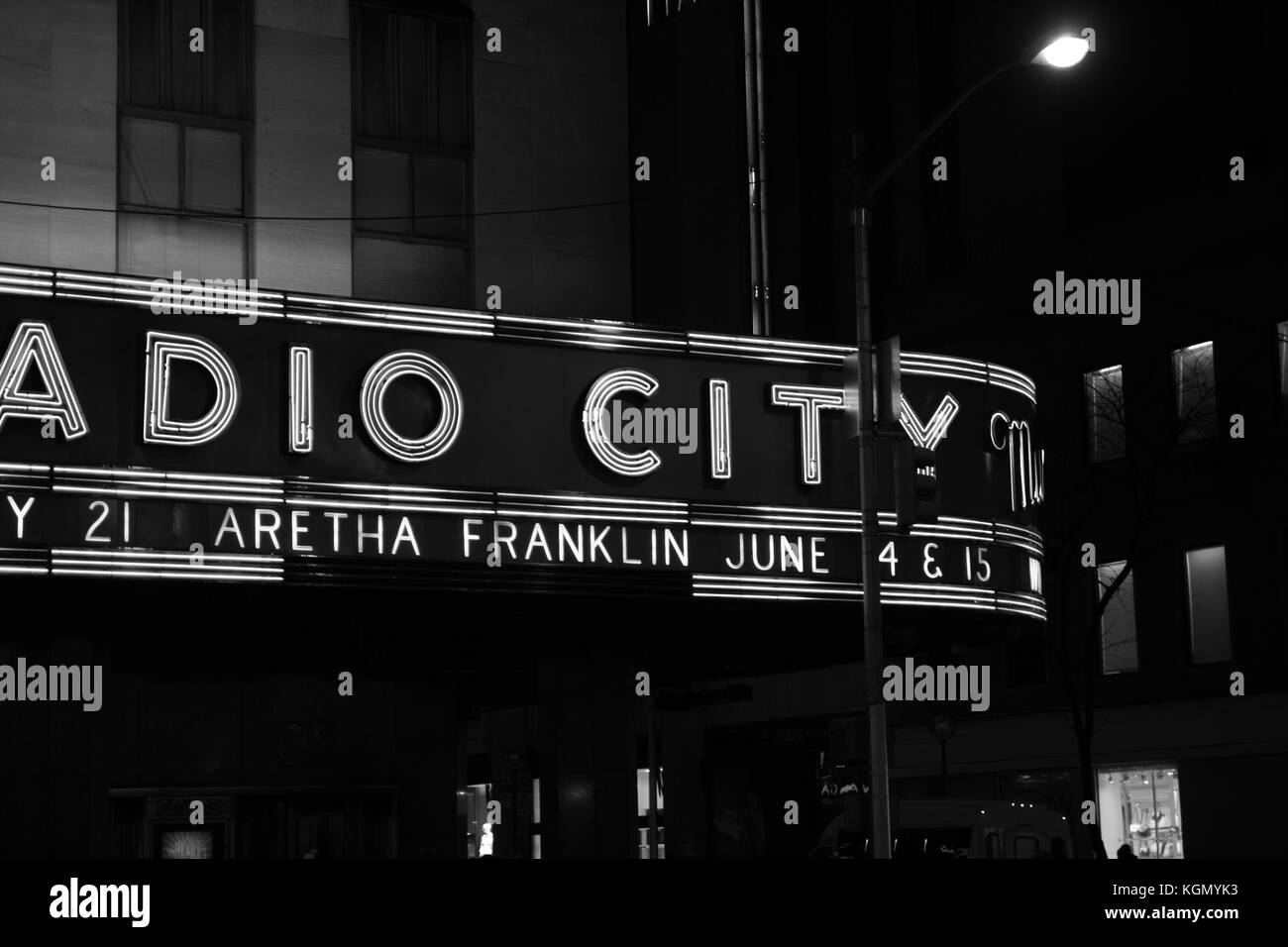 The Radio City Music Hall at night, featuring Aretha Franklin concerts with led lights. Detail, Black and white image. Stock Photo