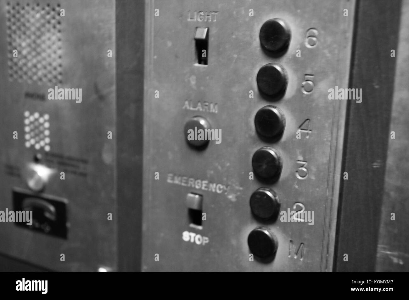 Old elevator buttons. Black and white detail. Stock Photo