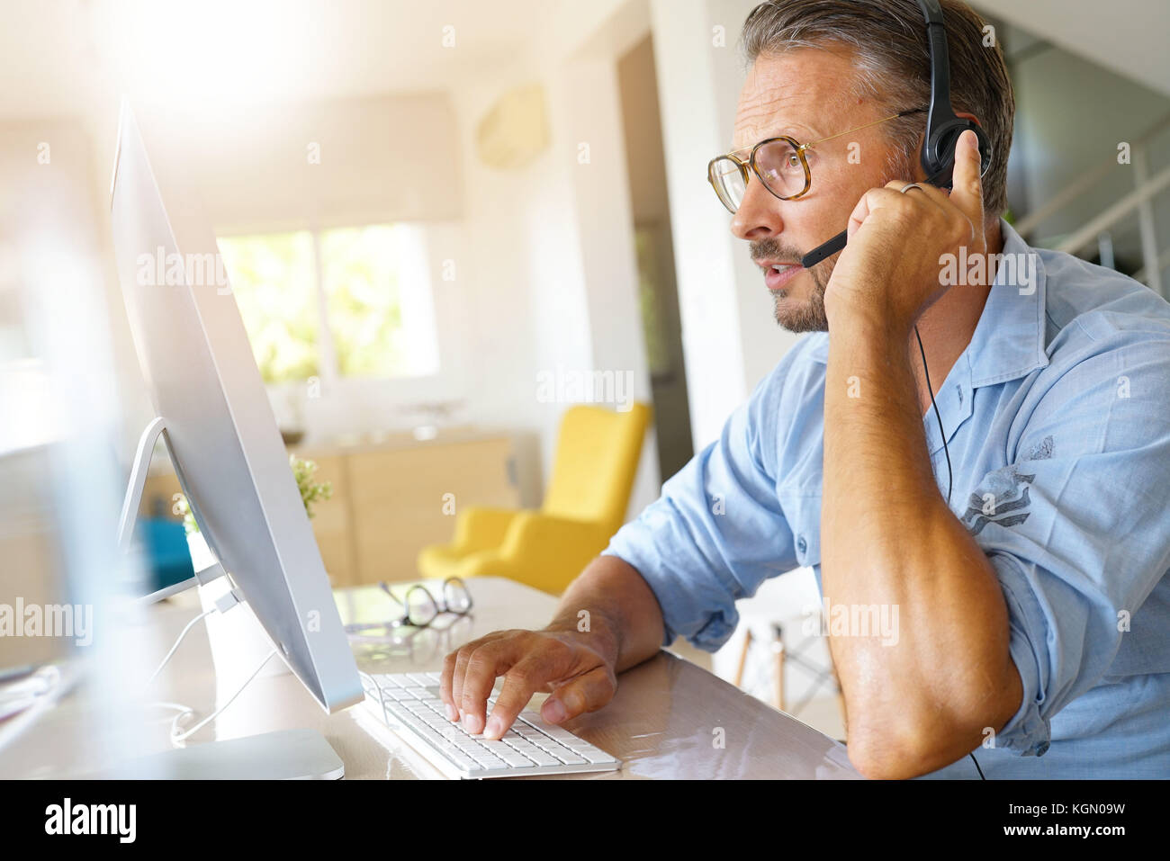 Businessman working from home, telework Stock Photo
