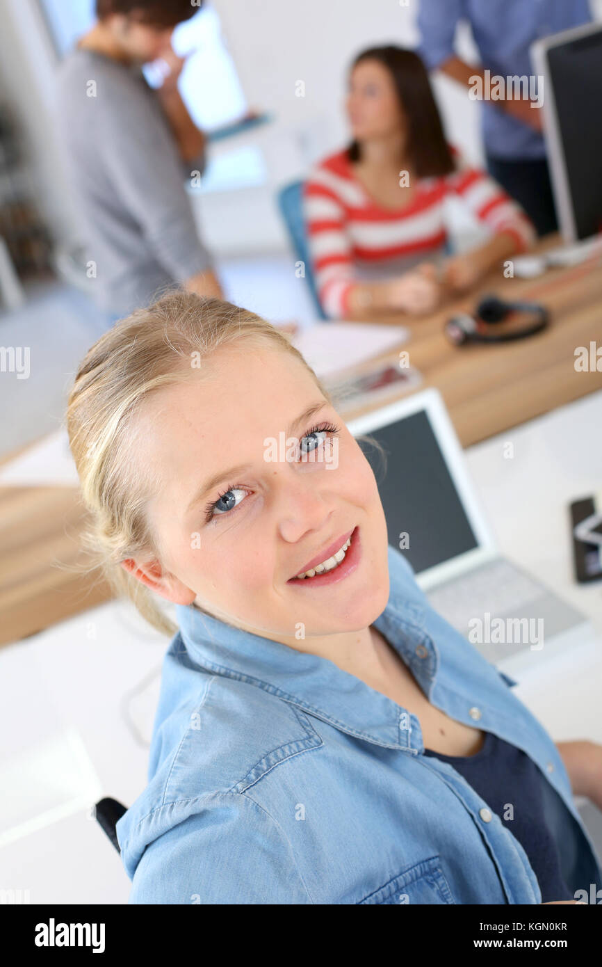 Portrait of smiling student girl in class Stock Photo - Alamy