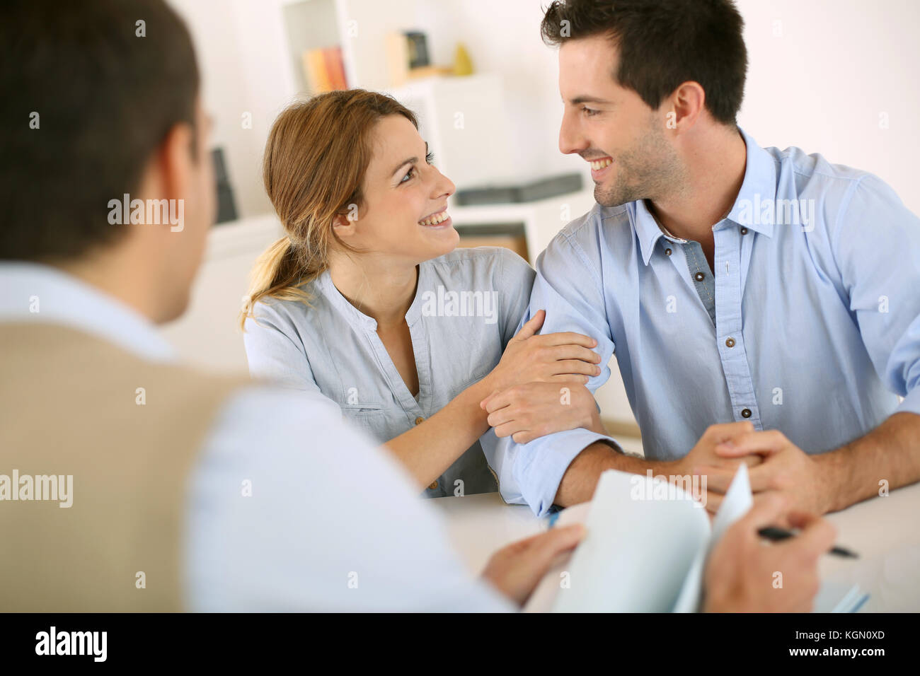 Young couple meeting construction planner Stock Photo