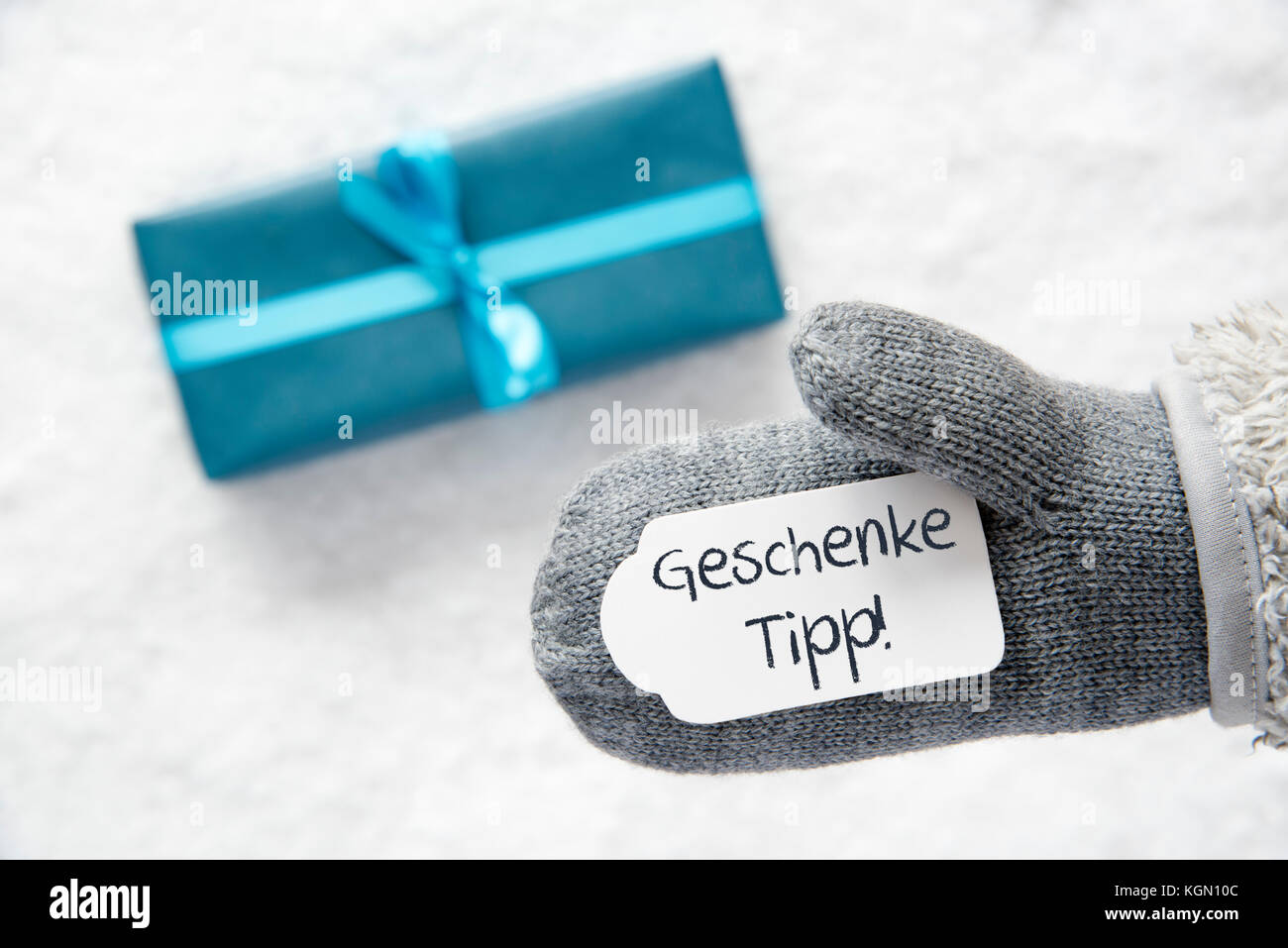 Turquoise Gift, Glove, Geschenke Tipp Means Gift Tip Stock Photo