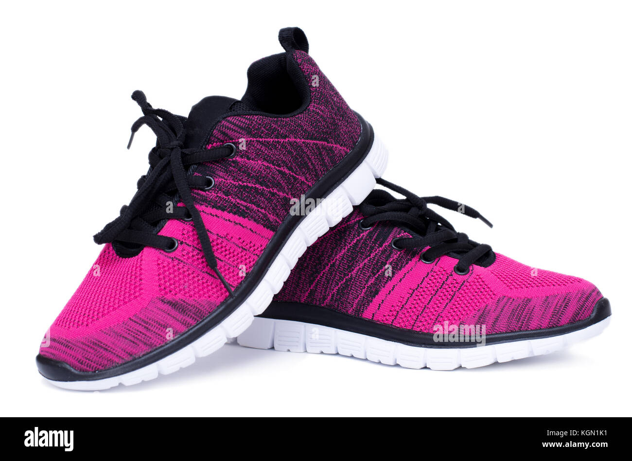 Pair of pink and black sport woman shoes isolated on white background Stock Photo