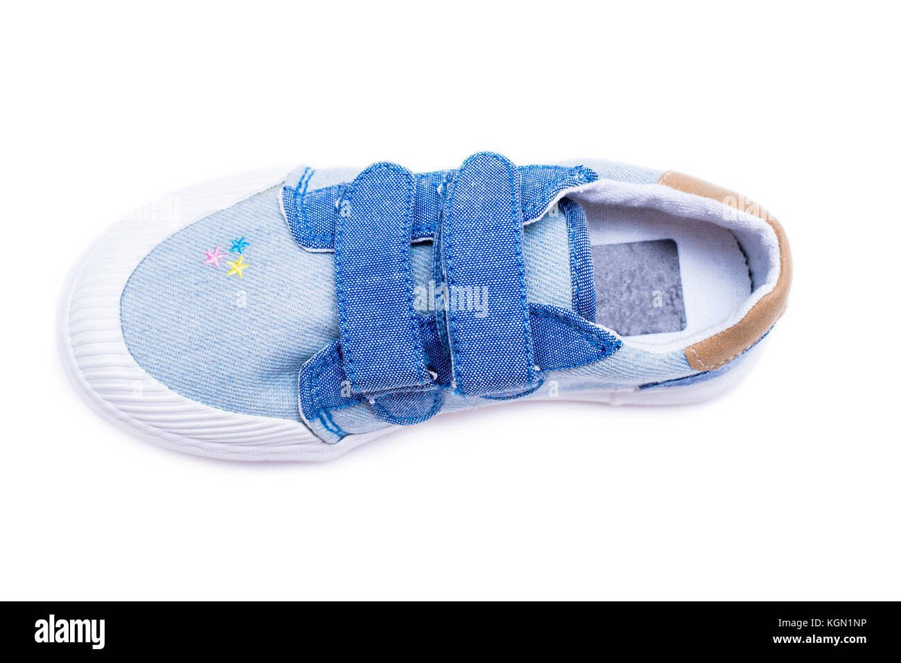 Fashion denim baby shoes for the toddlers feet. Kids sneakers isolated