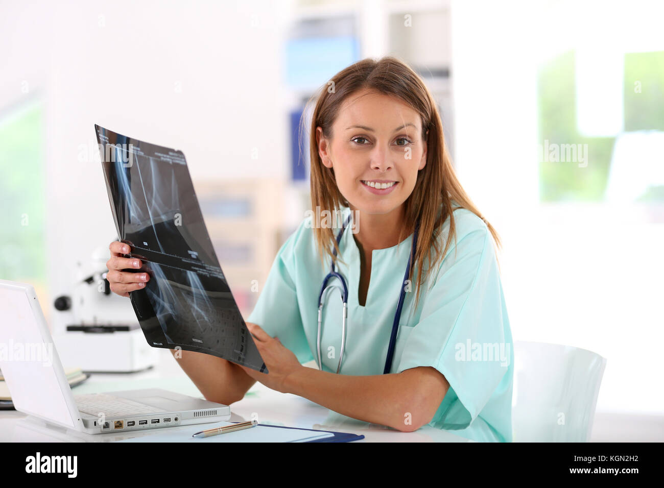 Nurse reading X-Ray results in hospital office Stock Photo - Alamy