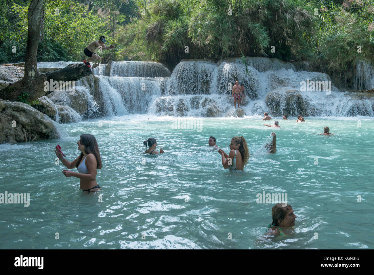 Tourist are enjoying swimming at Tat Kuang Si Waterfall, Luang Prabang ...