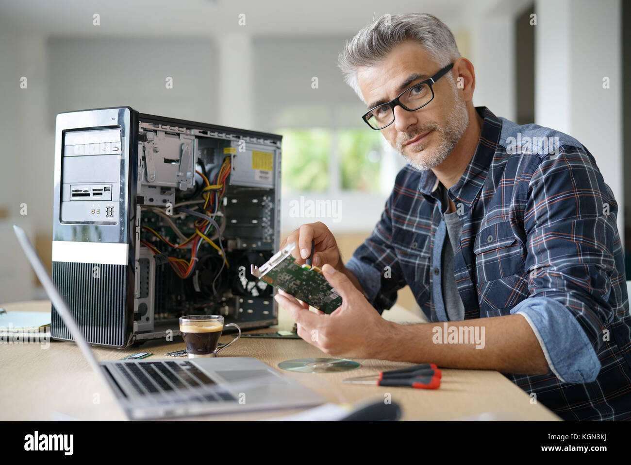 Technician repairing computer hardware Stock Photo - Alamy