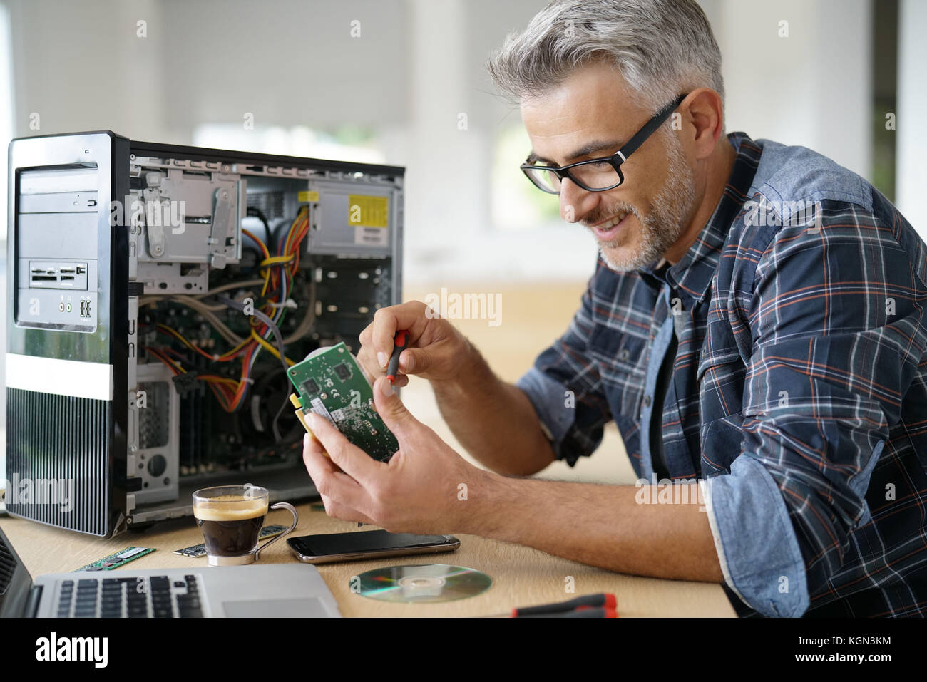 Technician repairing computer hardware Stock Photo Alamy