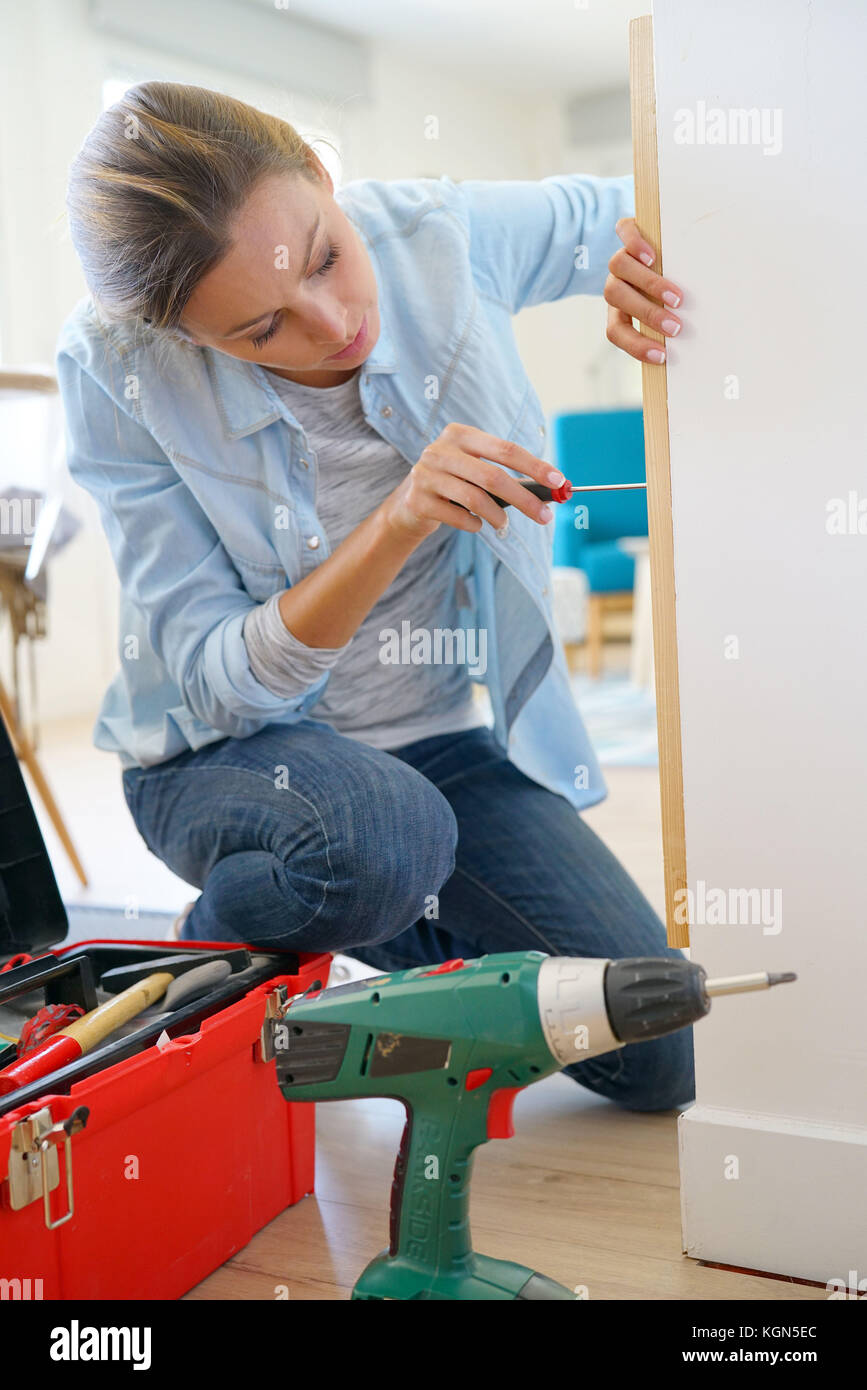 Woman doing DIY work at home Stock Photo - Alamy