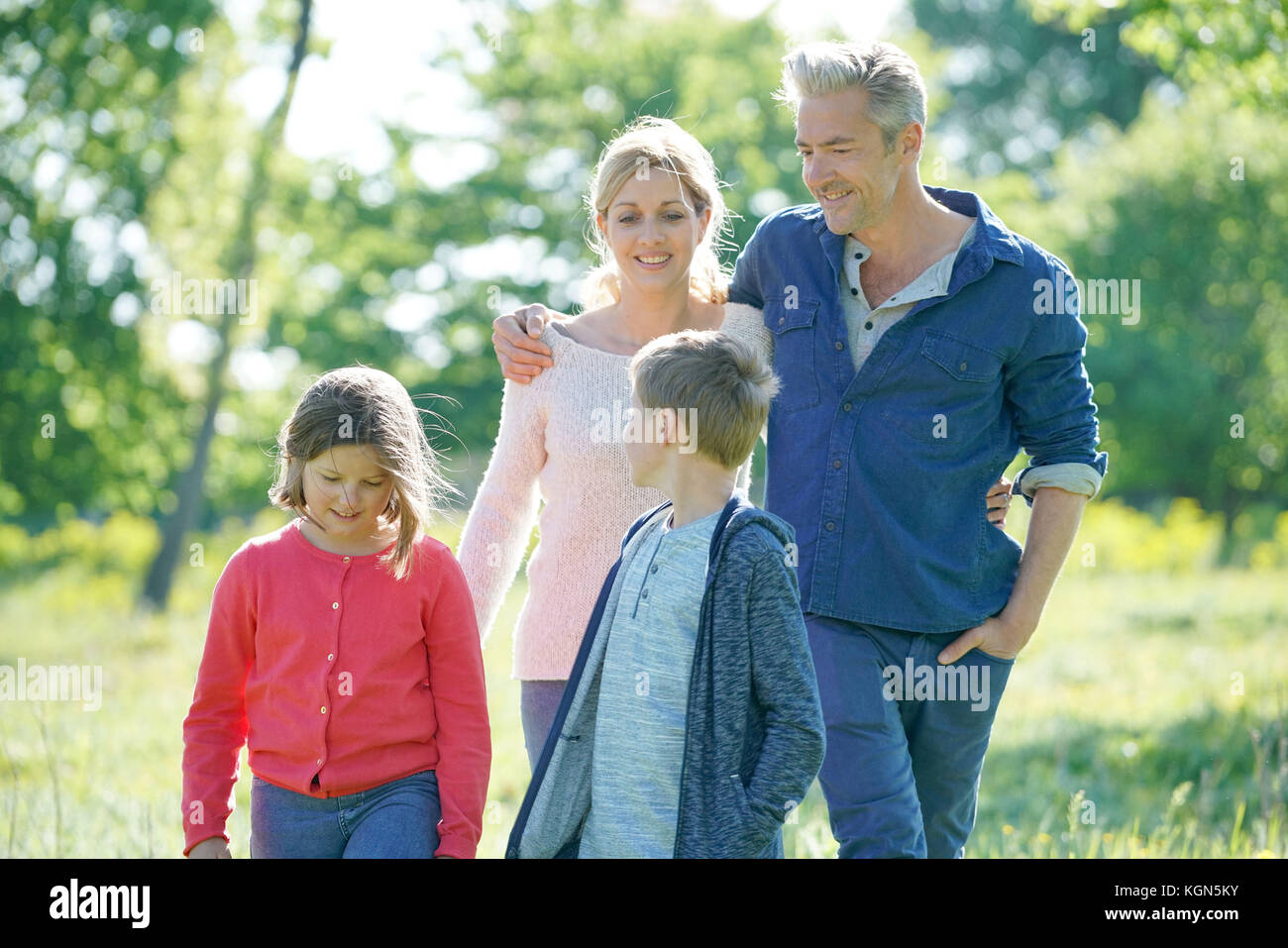Cheerful family walking in hi-res stock photography and images - Alamy