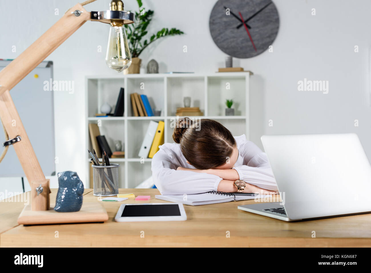 businesswoman sleeping on desk Stock Photo - Alamy