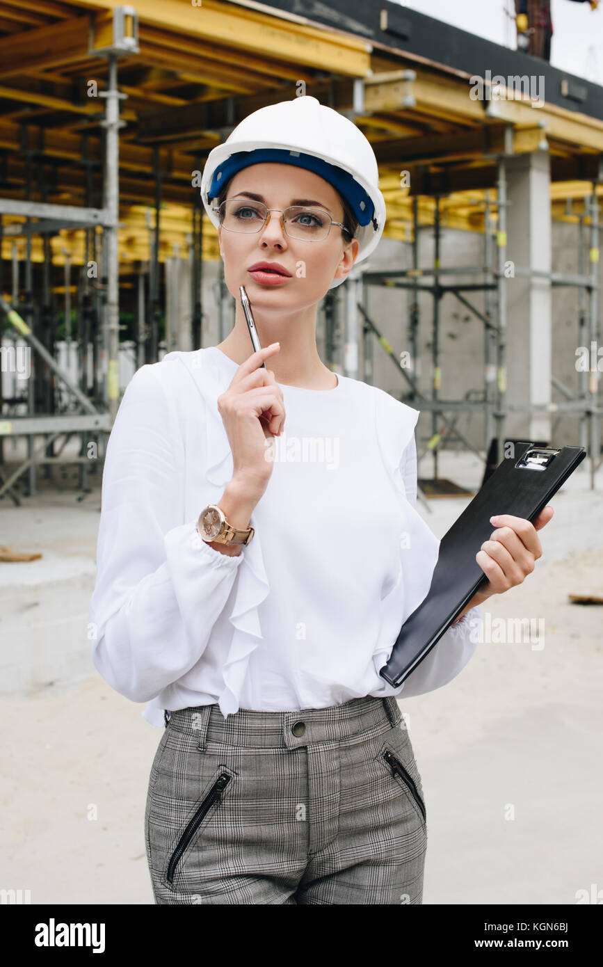 Engineer woman clipboard building hi-res stock photography and images ...