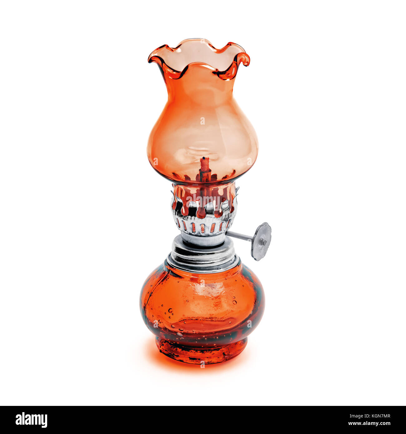 Oil lamp wick lantern made of red glass and metal isolated on