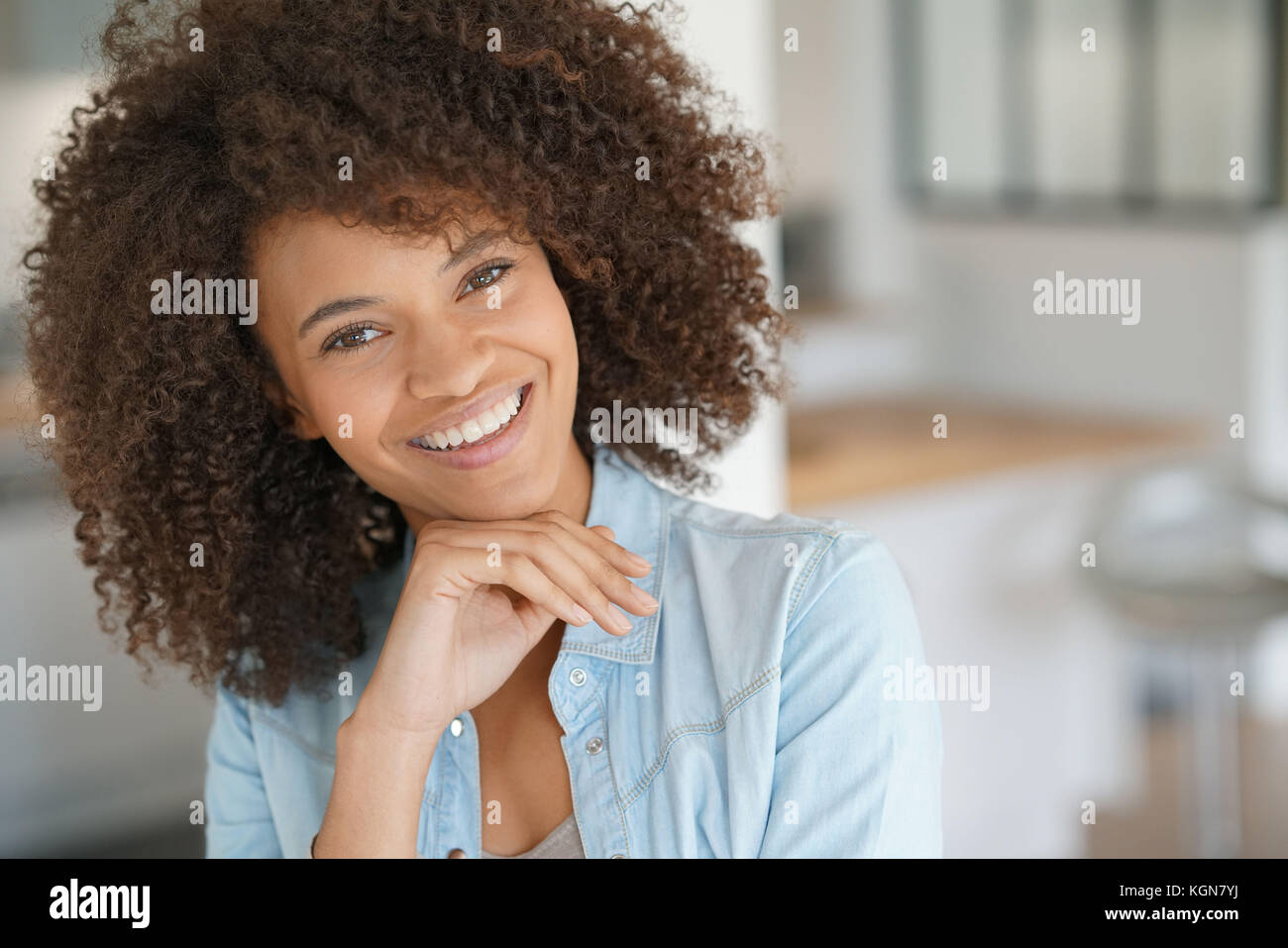 Attractive smiling mixedrace girl at home Stock Photo Alamy