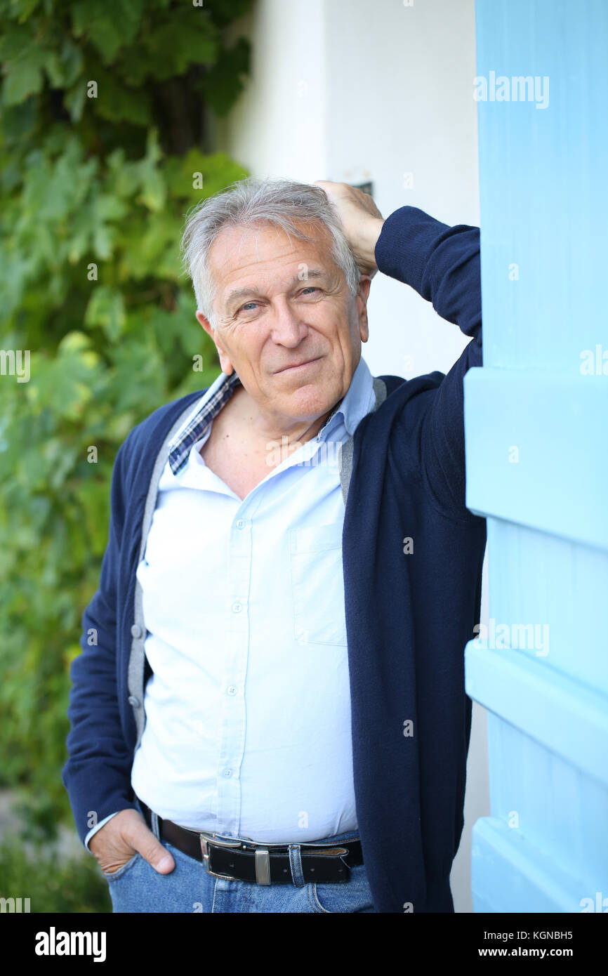 Senior man leaning on garden hi-res stock photography and images - Alamy