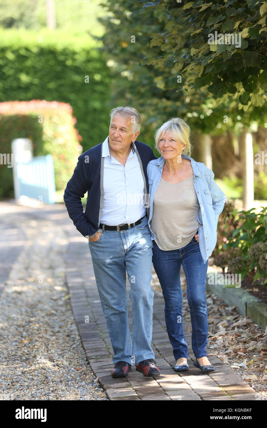 Joyful senior couple walking hi-res stock photography and images - Alamy