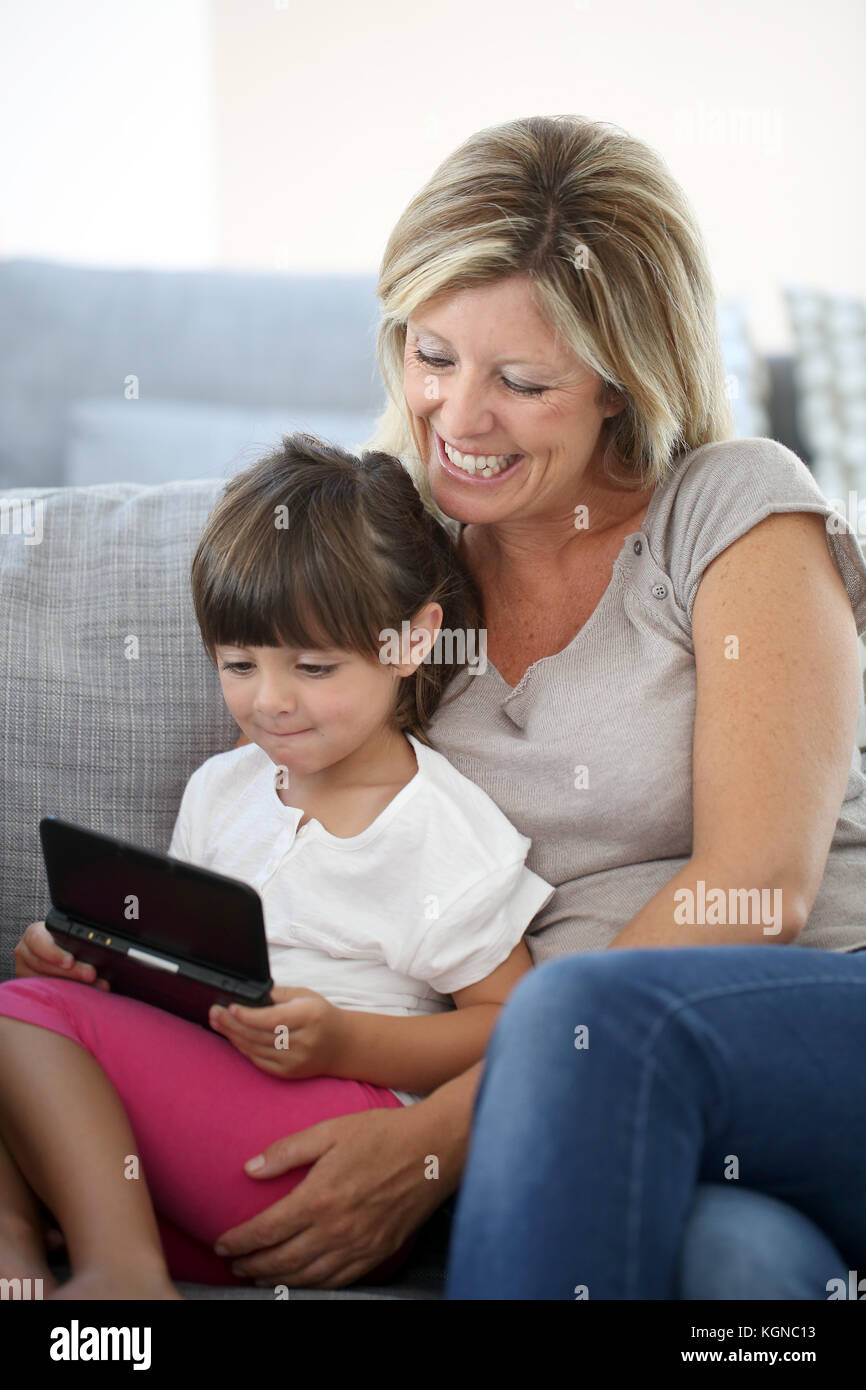 Mother and daughter playing game at home Stock Photo Alamy