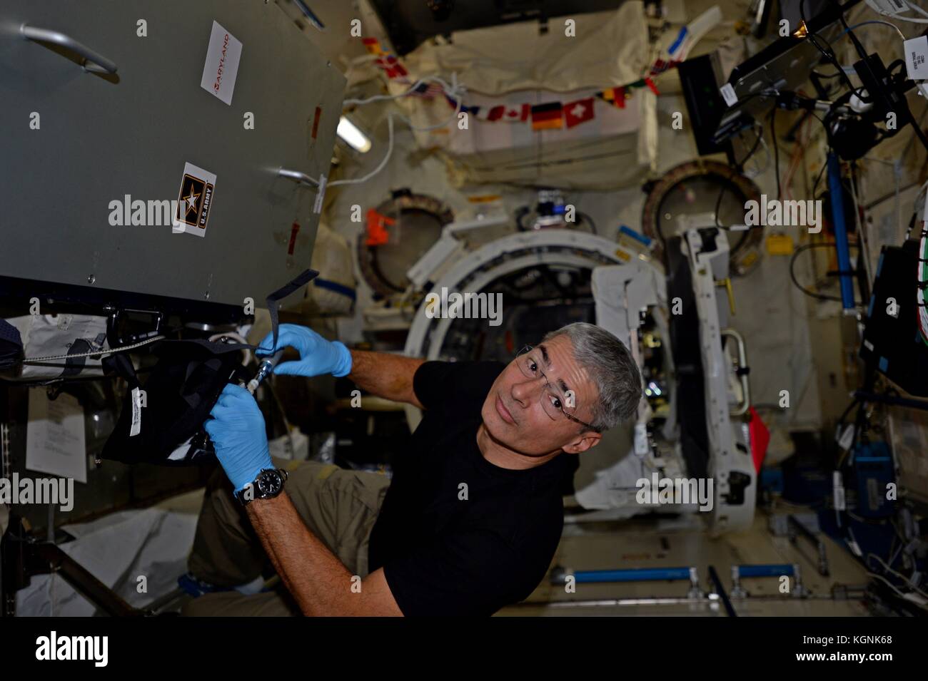 International Space Station, Earth Orbit. 08th Nov, 2017. Expedition 53 American astronaut Mark Vande Hei prepares the Japanese Space Agency satellites for launch from the International Space Station November 8, 2017 in Earth Orbit. Credit: Planetpix/Alamy Live News Stock Photo