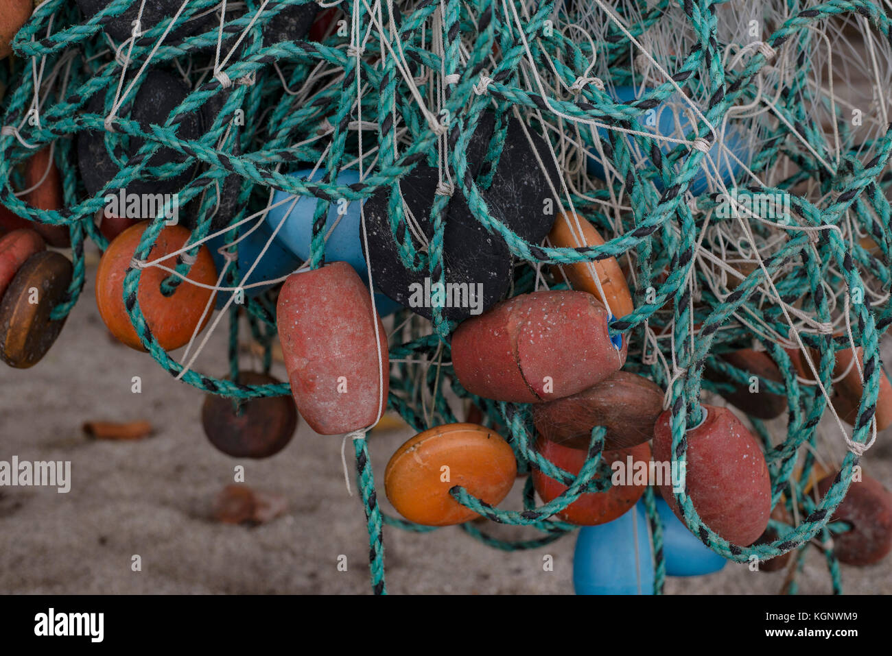 Close-up of tangled fishing net and buoys at beach, Tayrona, Columbia Stock Photo