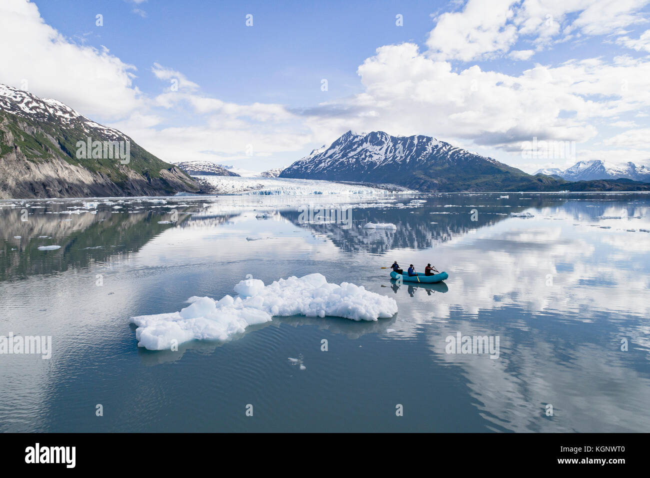 People rafting in glacier lagoon against sky, Lake George, Palmer, Alaska, USA Stock Photo