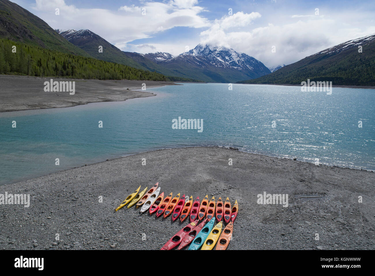 Colorful canoes at beach against sky, Anchorage, Alaska Stock Photo