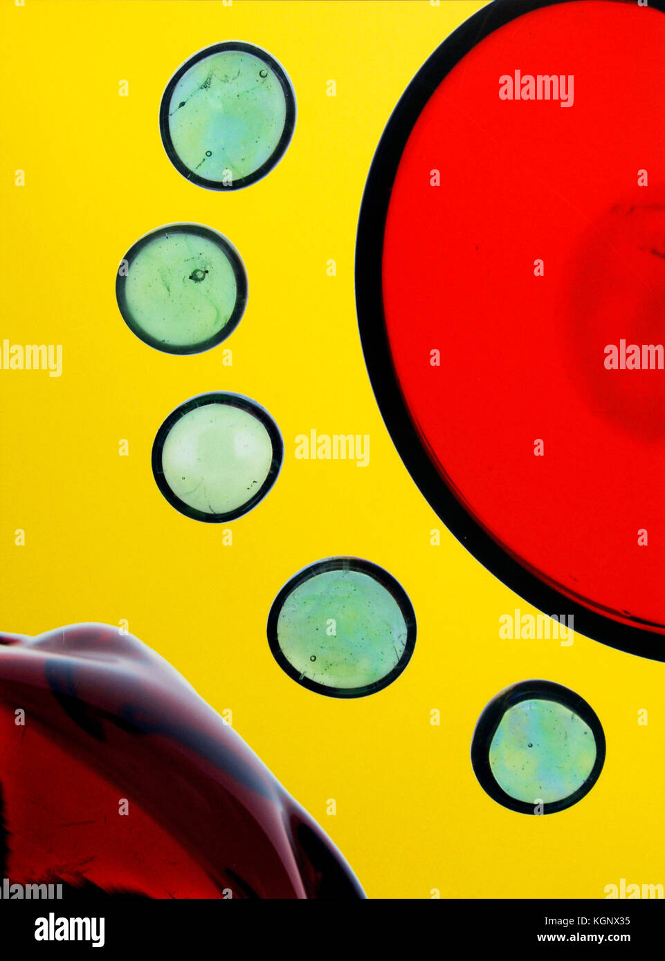 Abstract of red and green circles on yellow background Stock Photo
