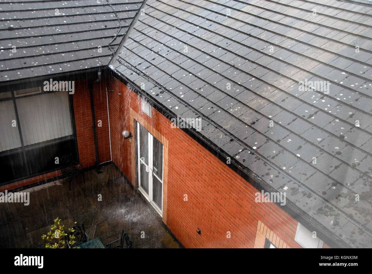 Gutter overflowing in heavy rain Stock Photo Alamy