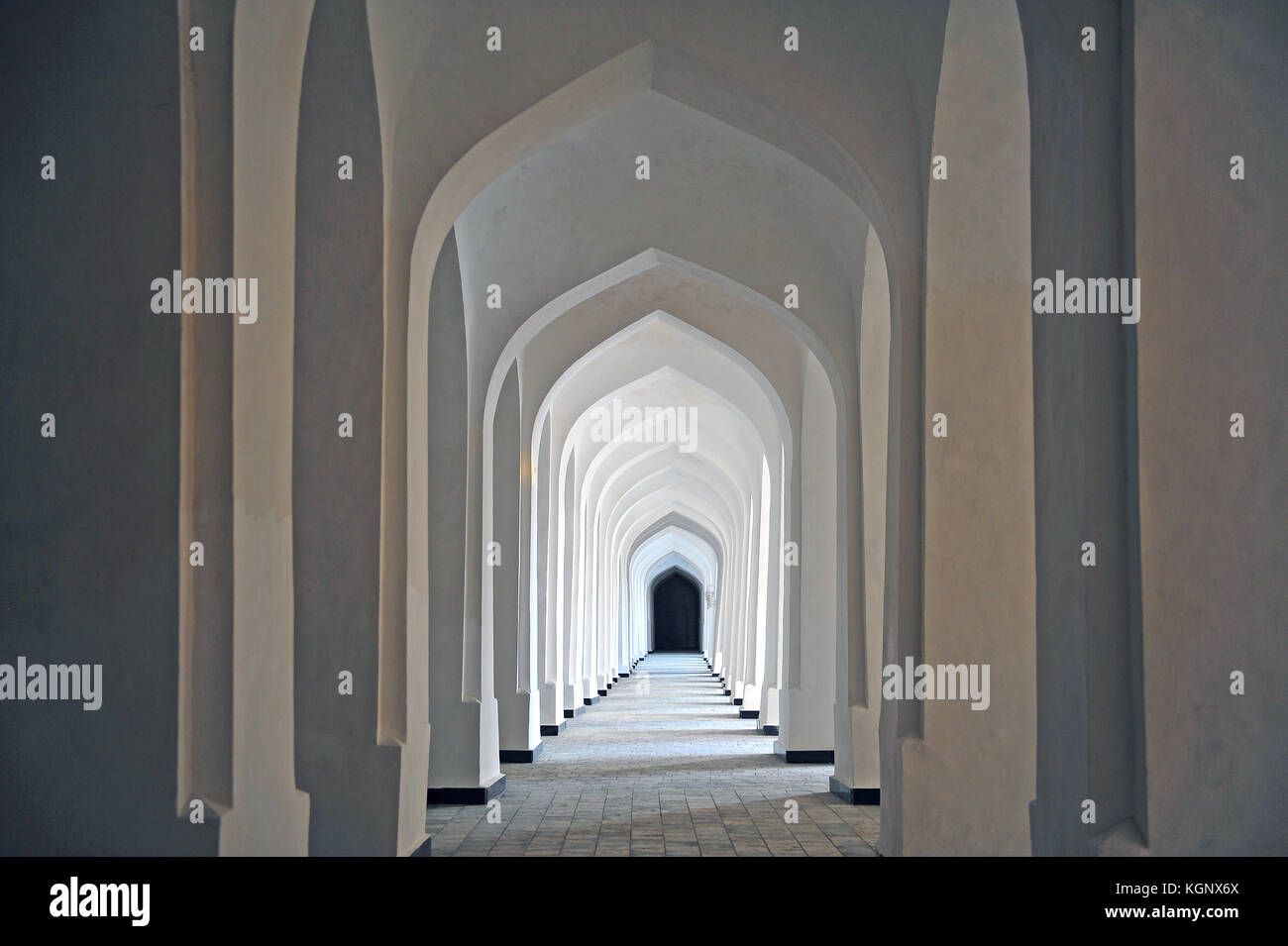 Bukhara: white corridor of madrassah Stock Photo - Alamy