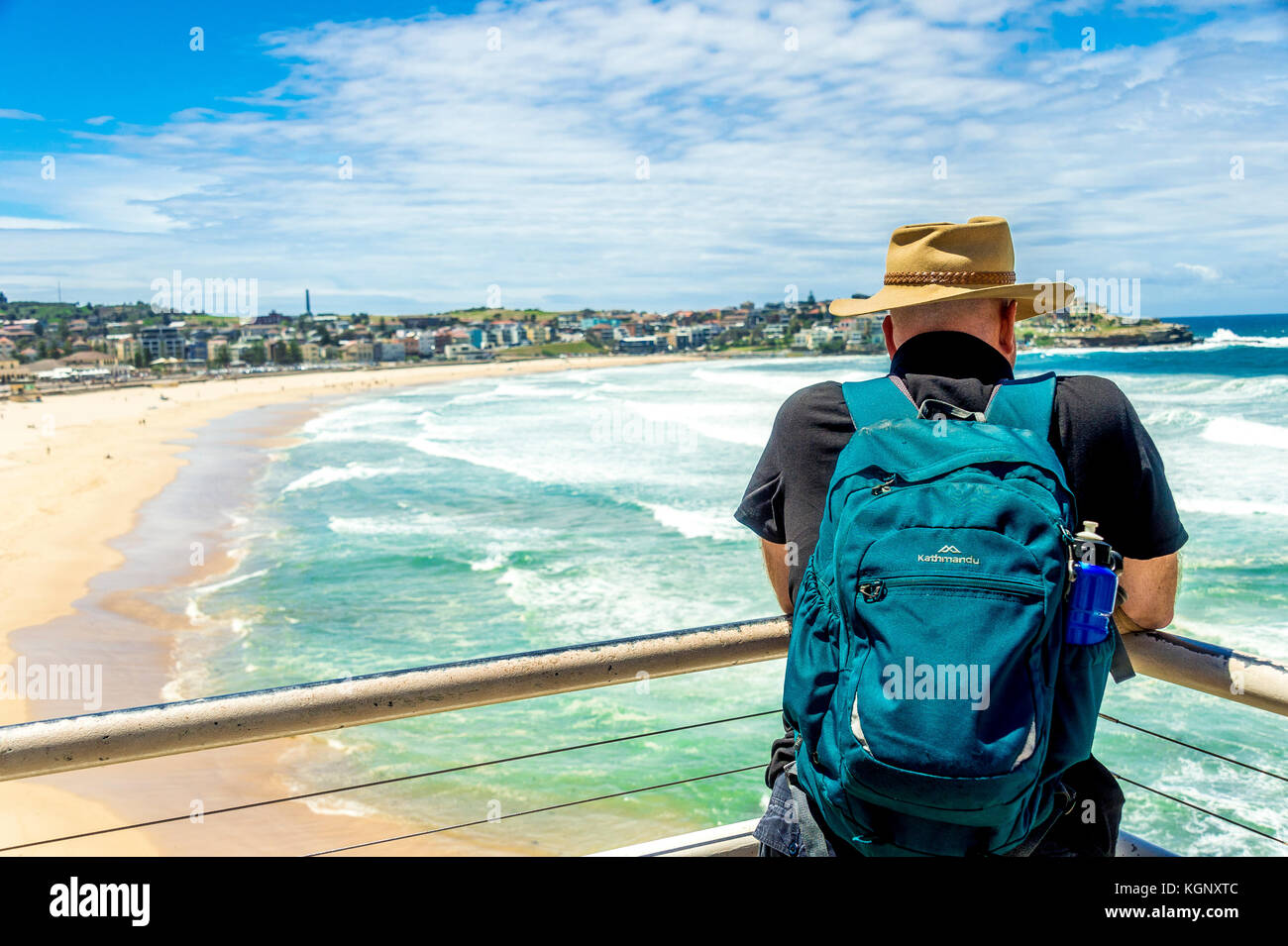 A local watches the waves roll into the famous Bondi Beach in Sydney, NSW, Australia Stock Photo