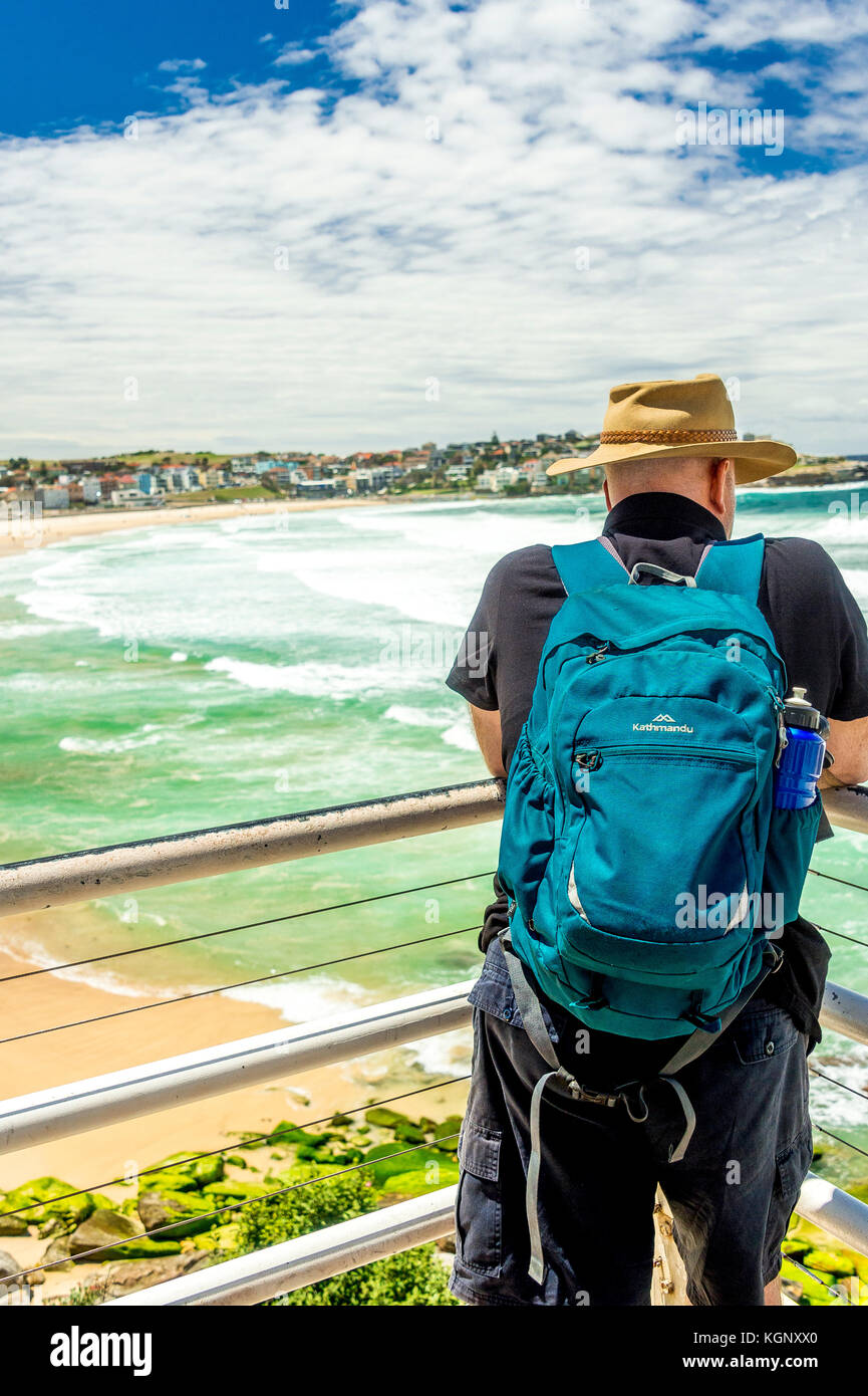 A local watches the waves roll into the famous Bondi Beach in Sydney, NSW, Australia Stock Photo