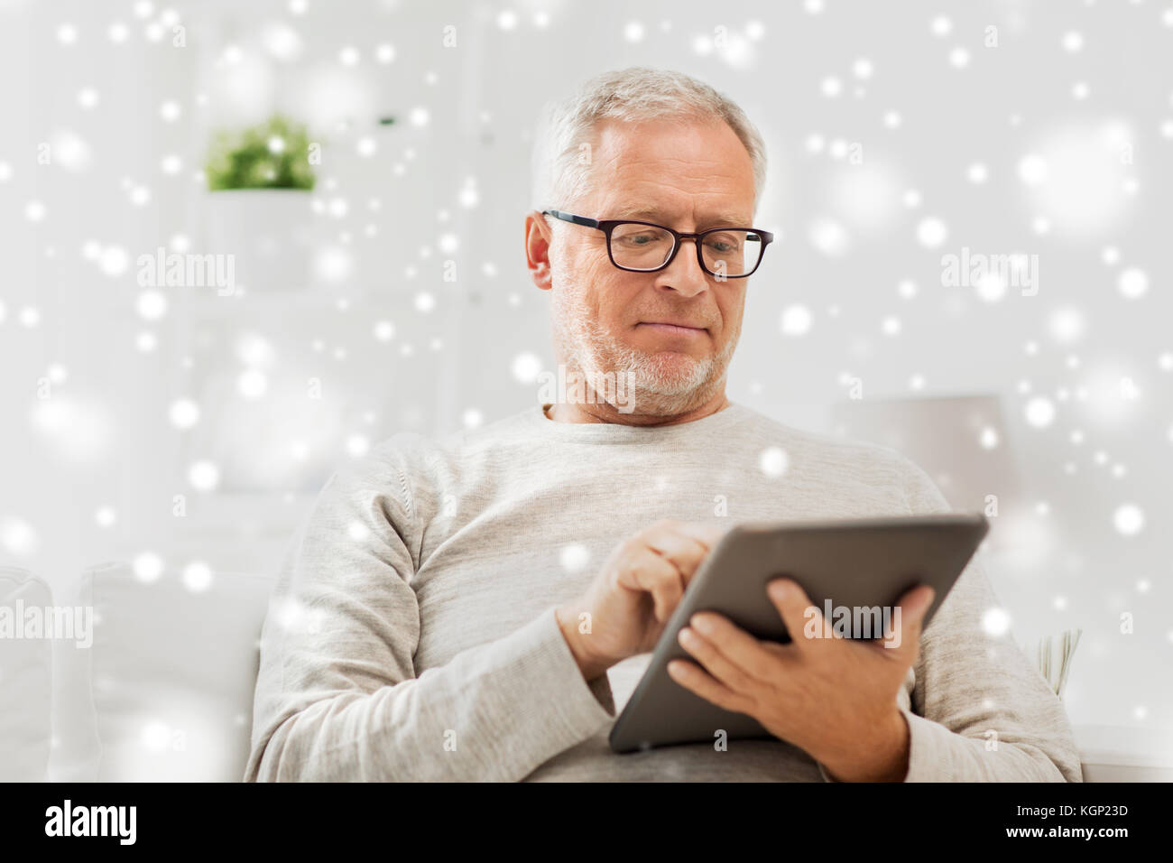 senior man with tablet pc at home Stock Photo