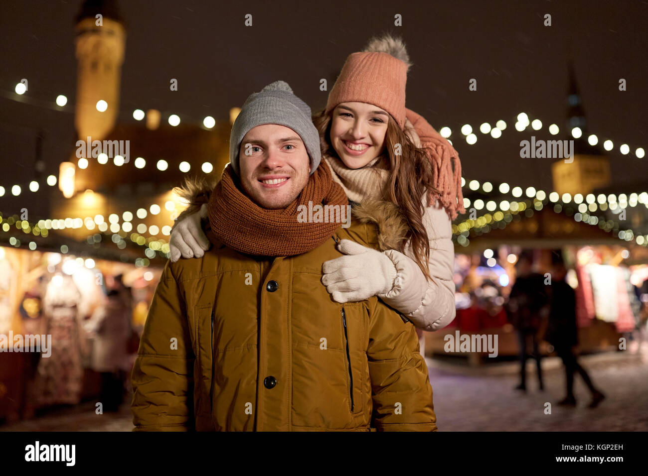 happy couple hugging at christmas market Stock Photo