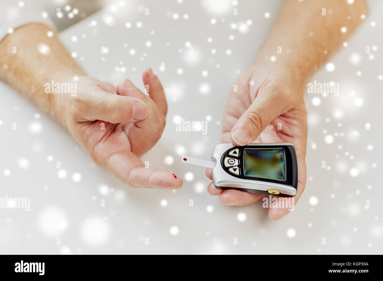 Man Using Glucometer senior man with glucometer checking blood sugar Stock Photo - Alamy