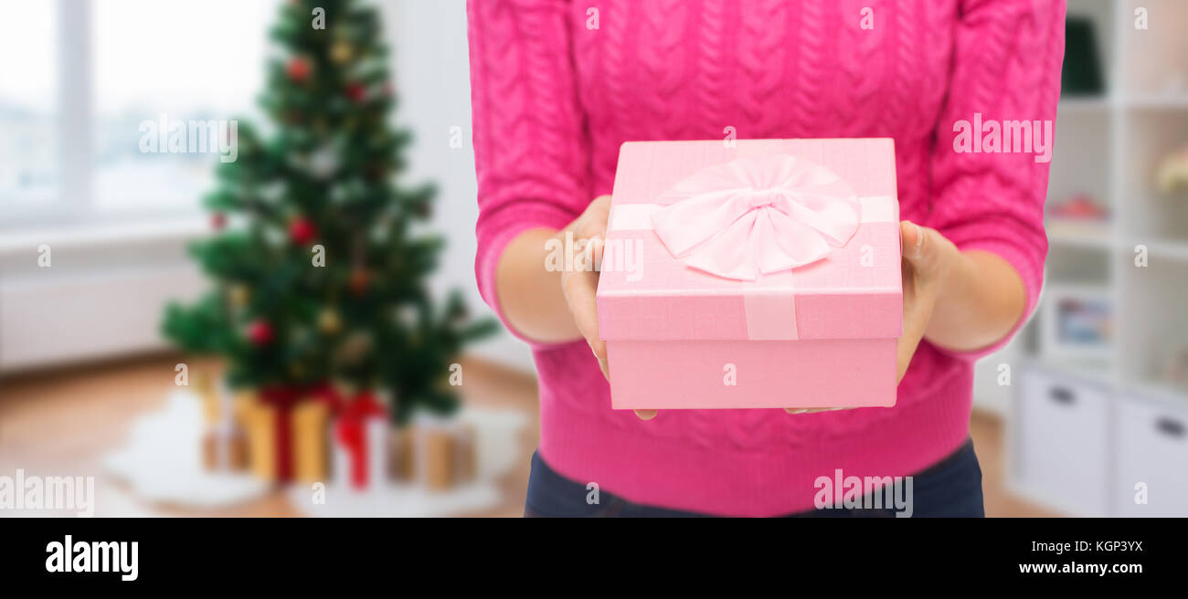 close up of woman hands holding christmas gift Stock Photo - Alamy