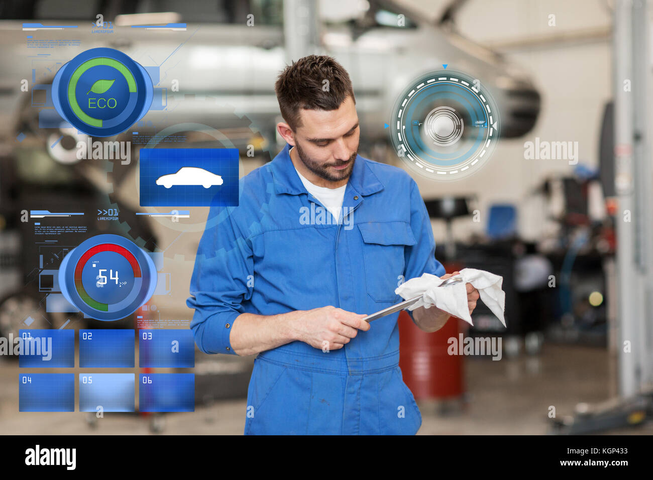 auto mechanic or smith with wrench at car workshop Stock Photo