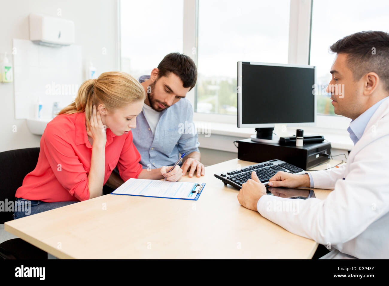 couple visiting doctor at family planning clinic Stock Photo Alamy