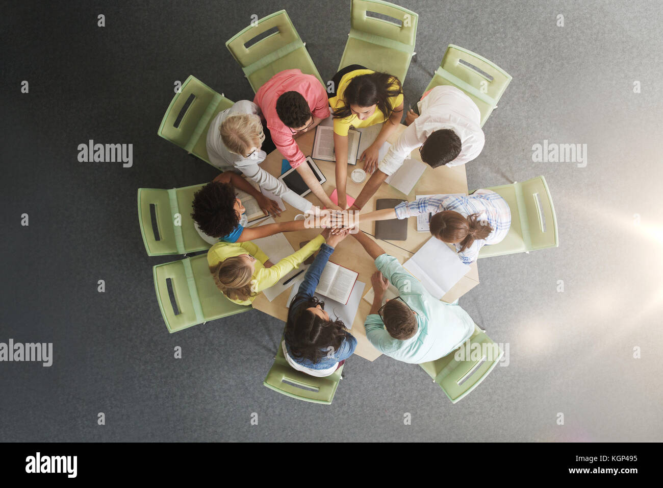 group of international students with hands on top Stock Photo - Alamy