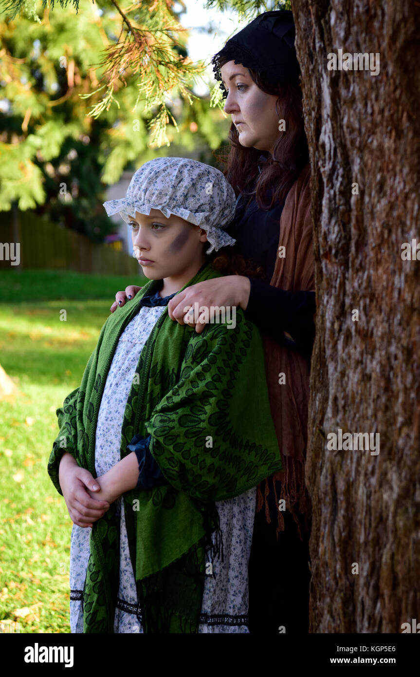 Characters Fanny Adams (30 April 1859-24 August 1867) & her mother Harriet in costume during a Halloween Ghost Walk around Alton, Hampshire, UK on Sun Stock Photo