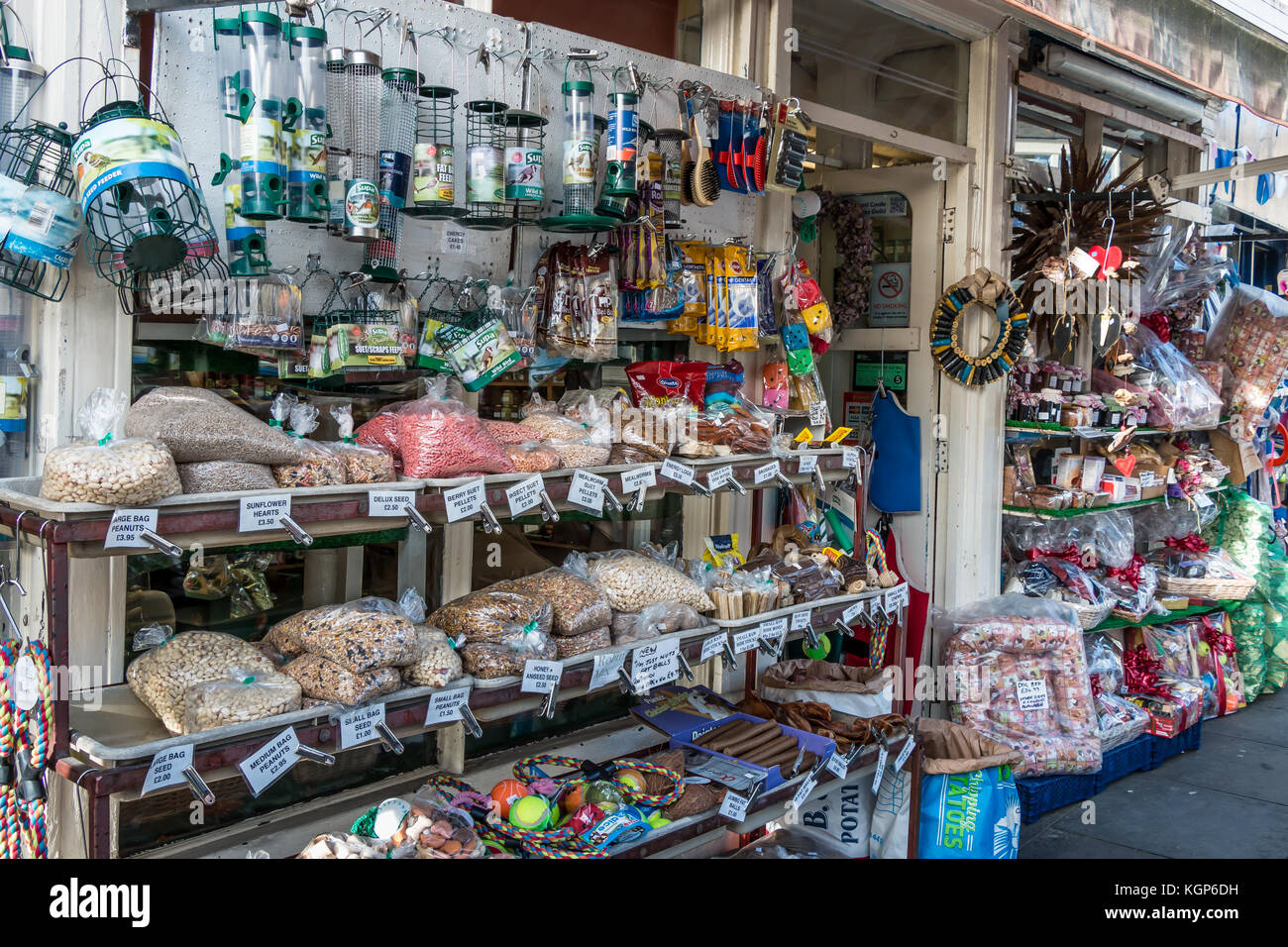 A display of wild bird food, bird feeders, pet accessories and toys outside a shop in Barnard Castle, Teesdale, UK Stock Photo