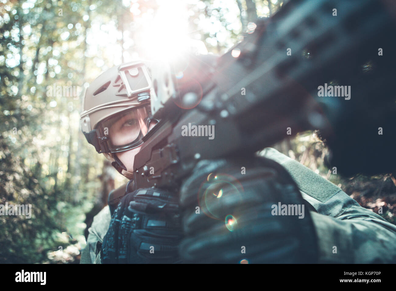 Image of military man in helmet and with submachine gun Stock Photo - Alamy