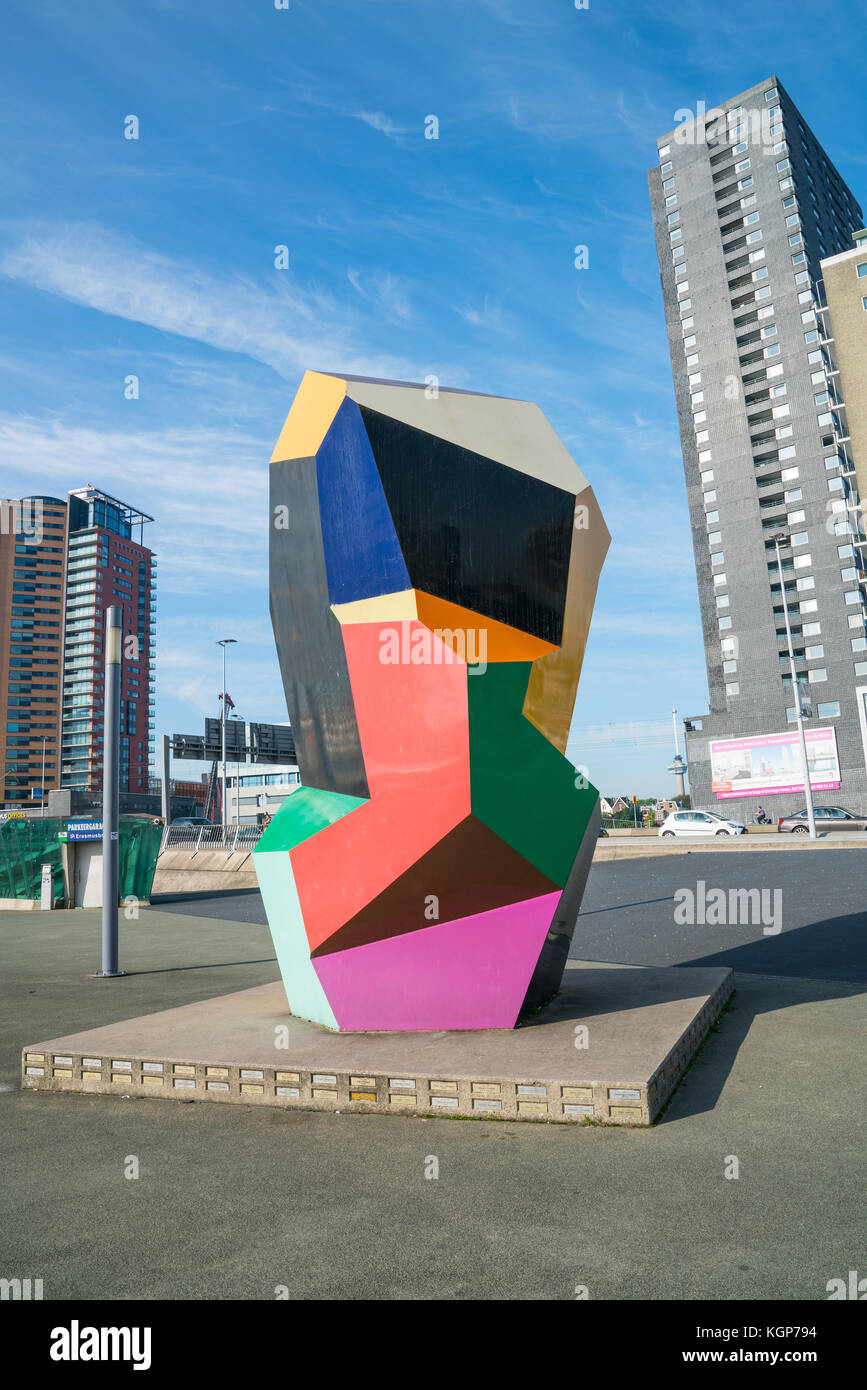 ROTTERDAM, HOLLAND -AUGUST 22, 2017; Multi-colored cubic sculpture in Erasmuburg district with city's stunning modern architectural buildings forming  Stock Photo