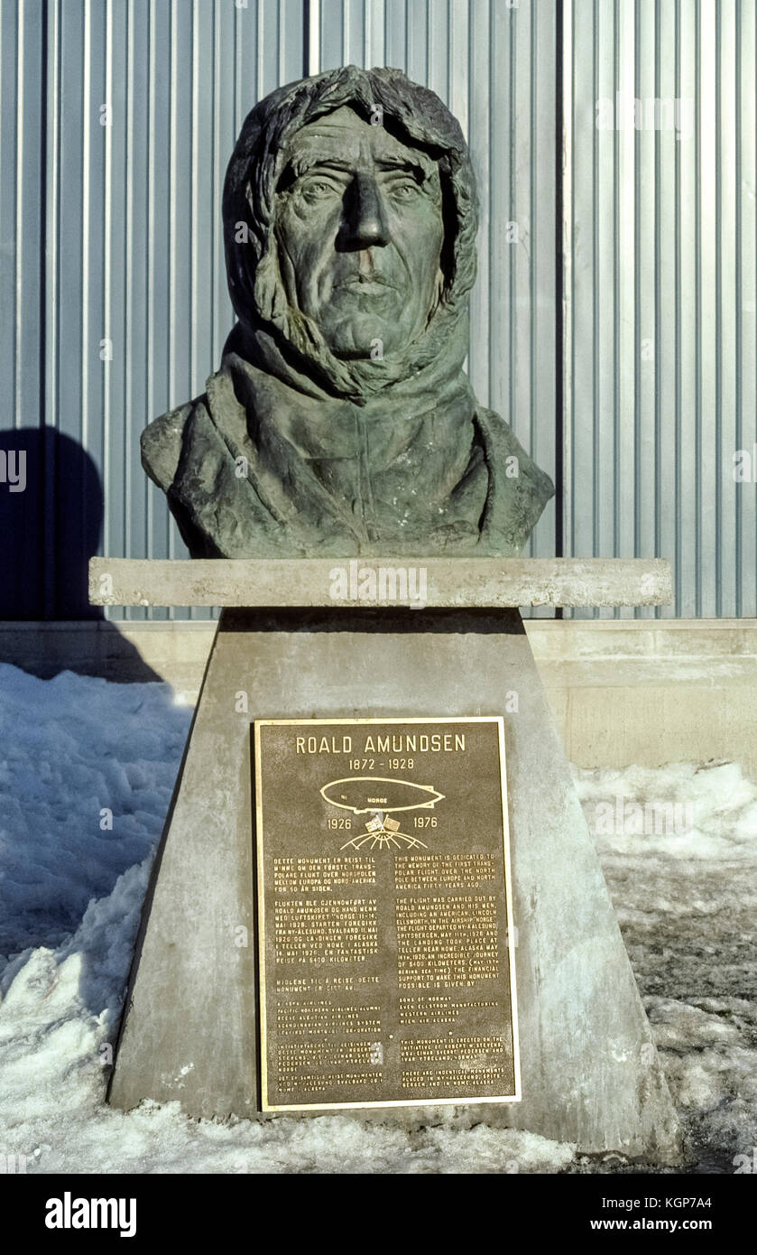 A bronze bust in Nome, Alaska, USA, honors Norwegian explorer Roald Amundsen, who made the first flight over the North Pole between Europe and North America in an airship in 1926. The “Norge” began its historic 3,355-mile (5400-kilometer) flight in Norway and landed three days later nearby Nome in Teller, a Native Alaskan (Eskimo) village on the Bering Sea. Twenty years earlier in 1906 Amundsen arrived at Nome by sea as the first person to successfully navigate the Northwest Passage in the Arctic and sail above North America from the Atlantic Ocean to the Pacific Ocean. Stock Photo