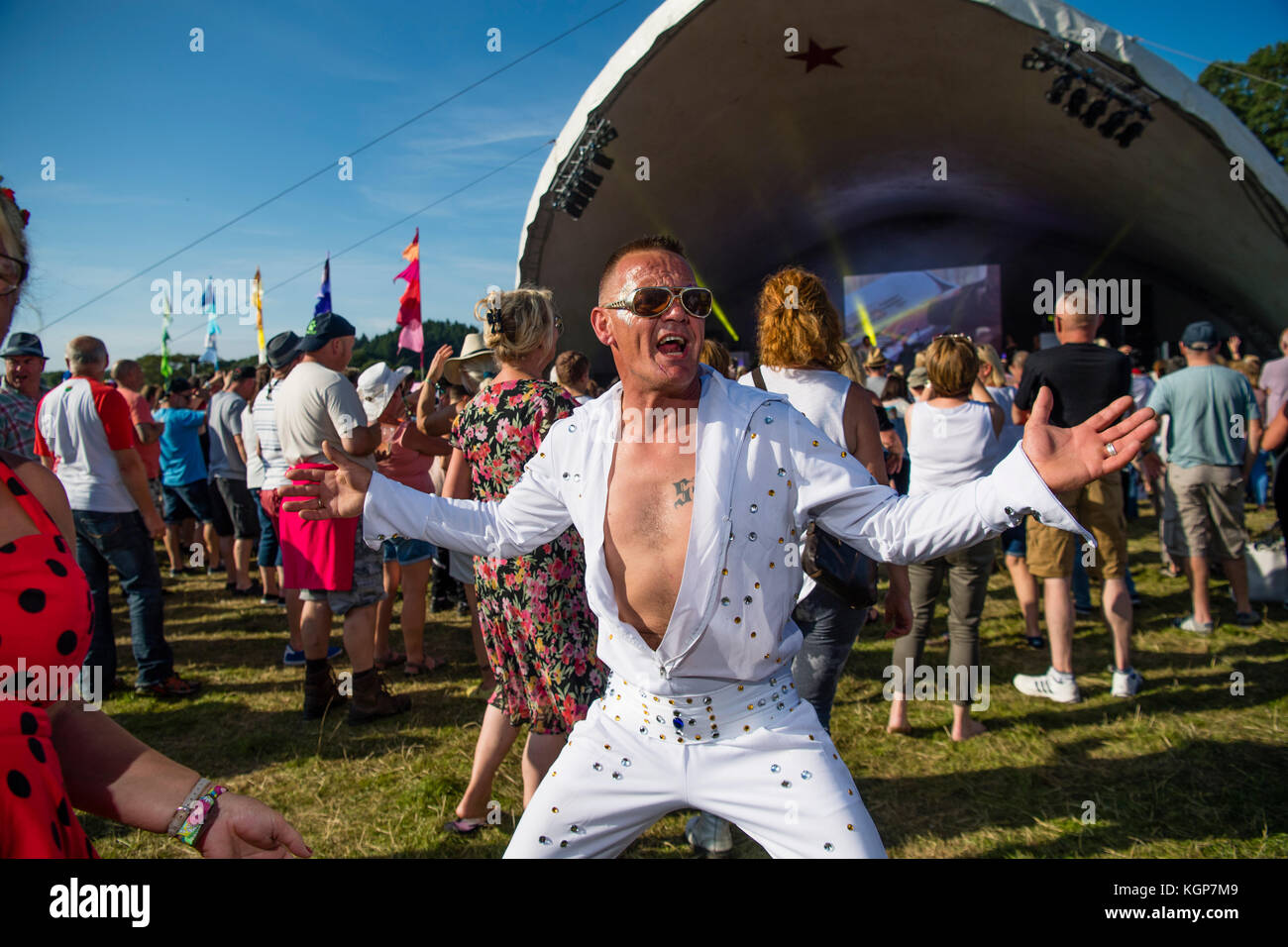 An Elvis Presley look-alike  at the Big Tribute music festival, held on the outskirts of Aberystwyth Wales on August Bank Holiday weekend 2017. The fetsival showcases covers acts and tribute bands and attracts thousands of fans from all over the UK Stock Photo