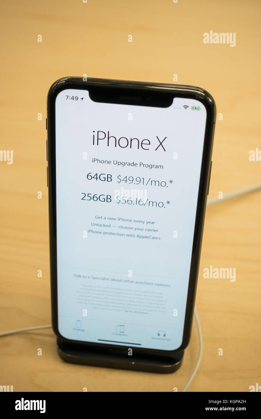 New iPhone X on a display at the Apple Store with pricing displayed on a  screen Stock Photo - Alamy