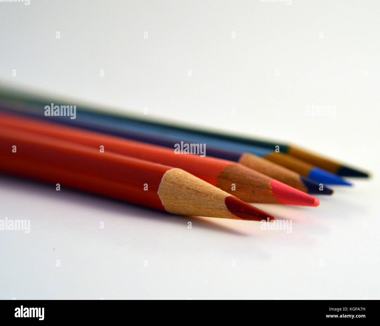 Colored pencils lined up in a row Stock Photo Alamy