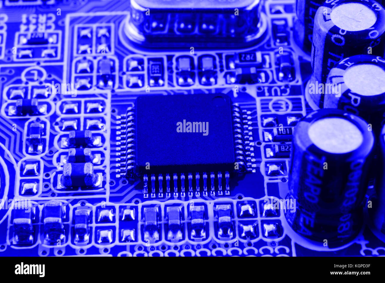 Resistors, capacitors and other electronic components of micro chip inside the computer close up