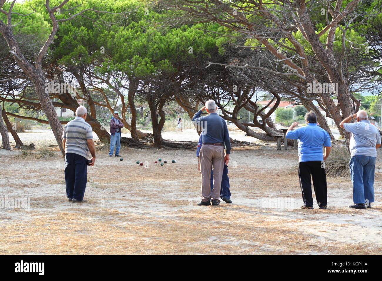 Pensioners playing Bocce the italian ball sport in Sardinia. Stock Photo