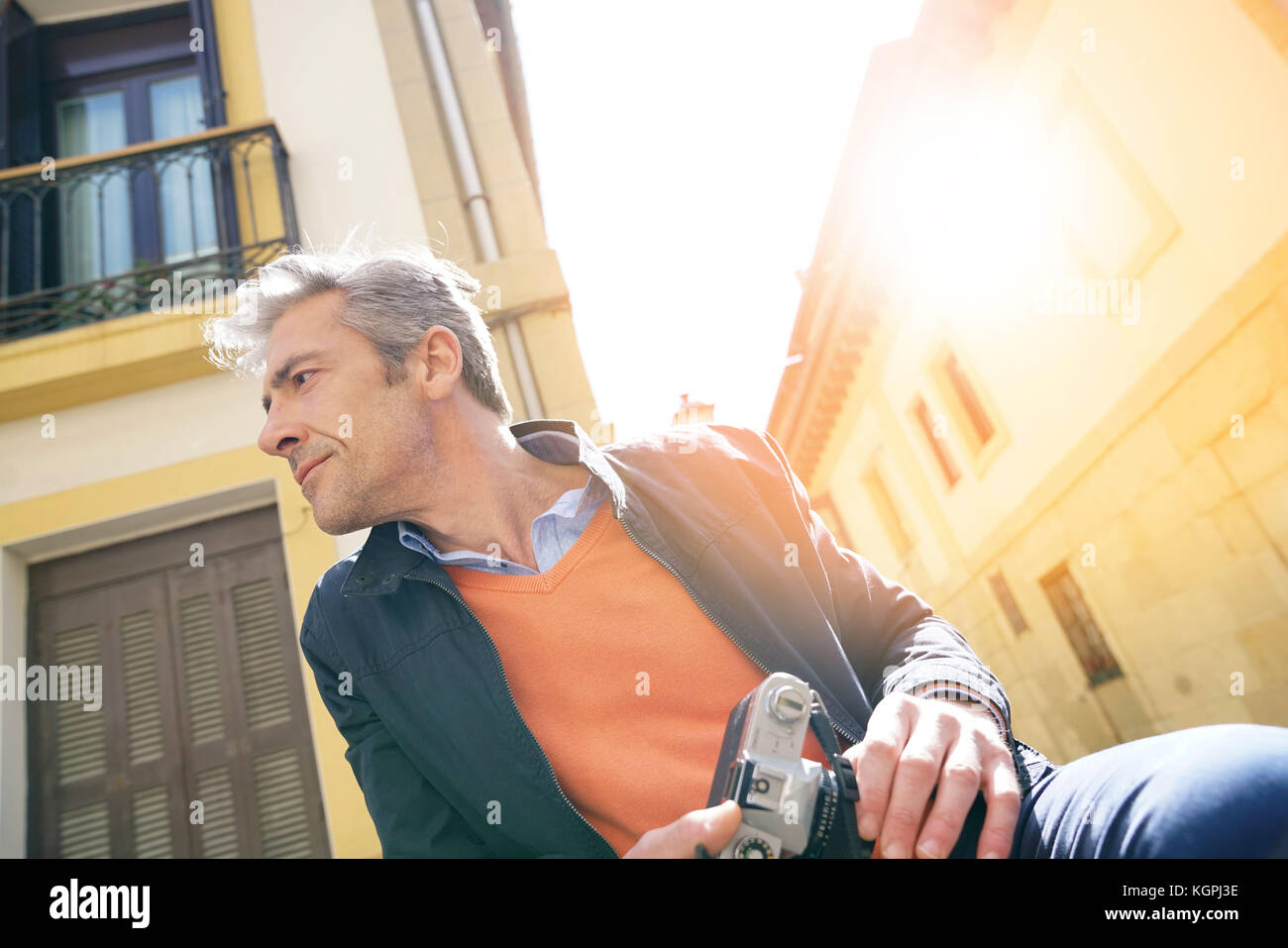 Photographer waiting in the street to take picture Stock Photo Alamy
