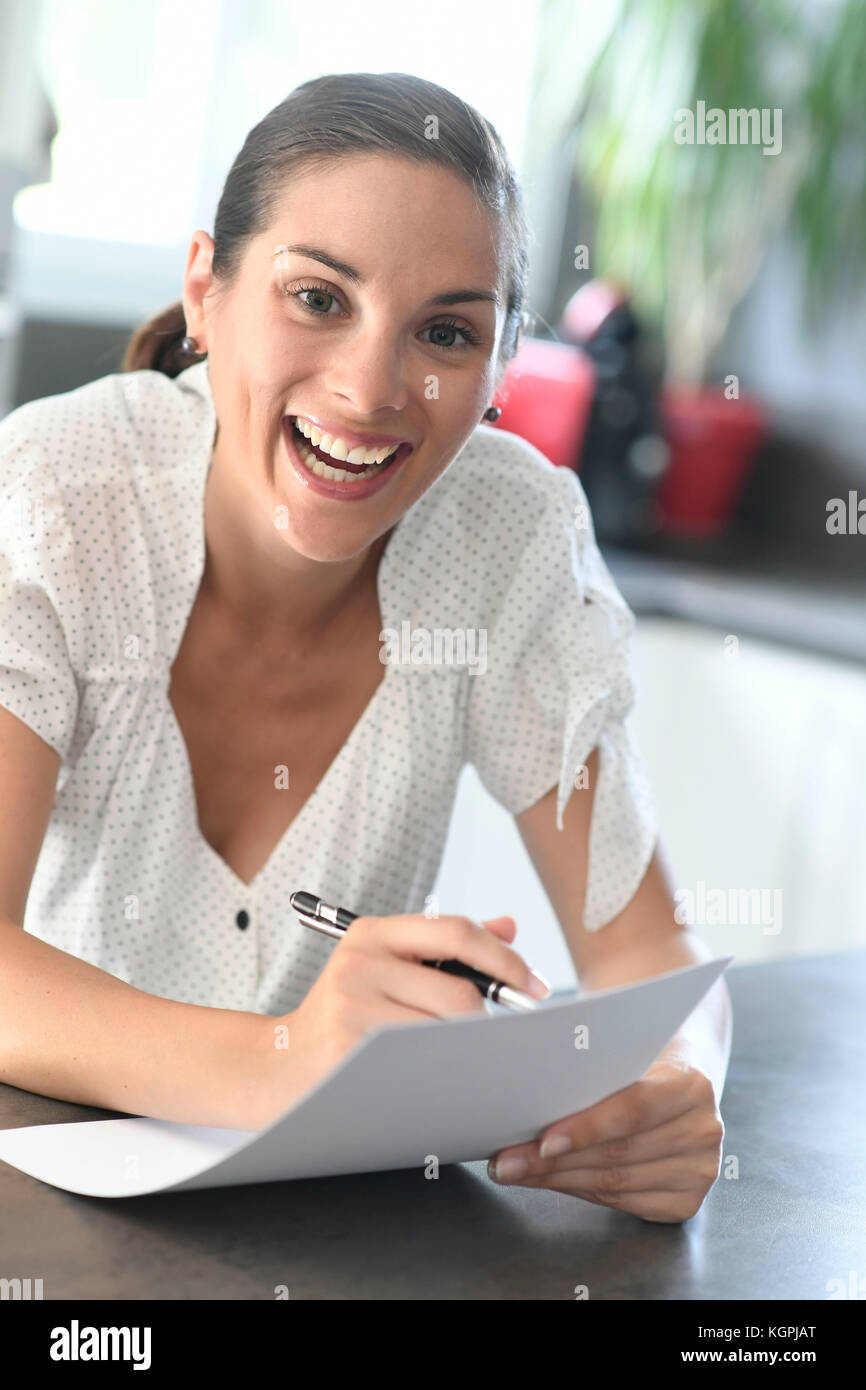 Woman writing a letter Stock Photo - Alamy